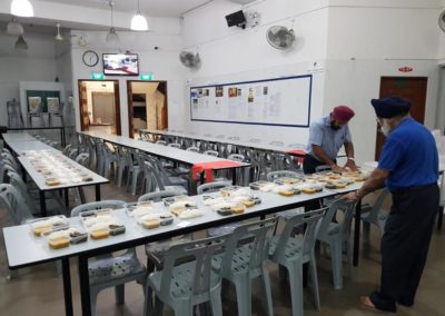 LOP volunteers at Khalsa Dharmak Sabha cook pack meals for the needy